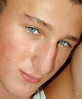 Tanned blue-eyed boy showing his beautiful body here