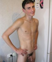 White socks horny-looking young boy shows his cock