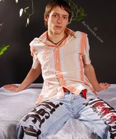 Stylish young boy finally taking his shirt off