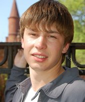 Playful twink posing outdoors and stripping indoors