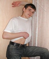 Tatted-up twink shows off in front of a camera