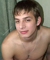 Pretty-looking twink posing in a sun-lit room