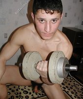 Jacked-up young twink checks himself out in the mirror