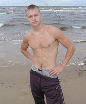 Blond-haired twink flashing his sexy junk on cam