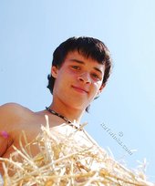 Dark-haired twink posing in the sun, looking sexy