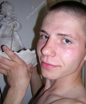 Kinky bald-headed twink putting his clothes back on