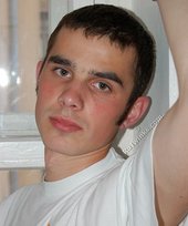 Twink with killer sideburns shows off his fave t-shirt