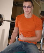 Cool shades twink posing shirtless in his gym