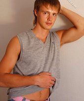 Blond-haired guy showing his armpits and muscular arms