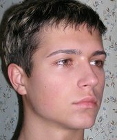 Slim guy with a perfectly tanned body shows off everything