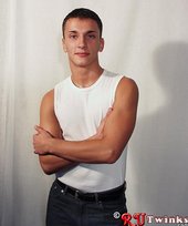 Good-looking guy with a girly-looking face shows his abs