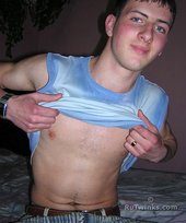 Young twink showing his soles and toes in the dark while stripping