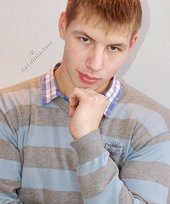 Young boy in red briefs showing his perfect abs on camera