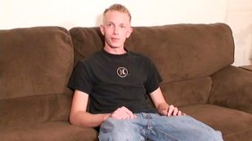 Skeletal blonde twink gets on all fours on a couch