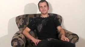 Dark-haired dude in a black t-shirt jerks off on cam