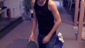 Wife-beater wearing dark-haired guy jerking on the floor