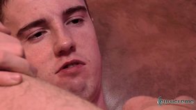 Dark-haired dude gets his asshole gaped on a leather couch