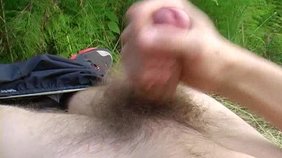 Blond-haired Russian twink jerking off in the woods
