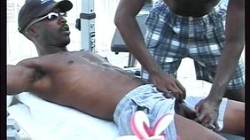 Black muscle daddy fucking his submissive partner outdoors