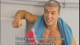 Jacked-up bald dude gets a blowjob from his gym buddy