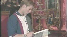 Two curly-haired dudes worship a throbbing boner