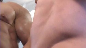 Absurdly muscular beefcake jerking his cock in front of the mirror